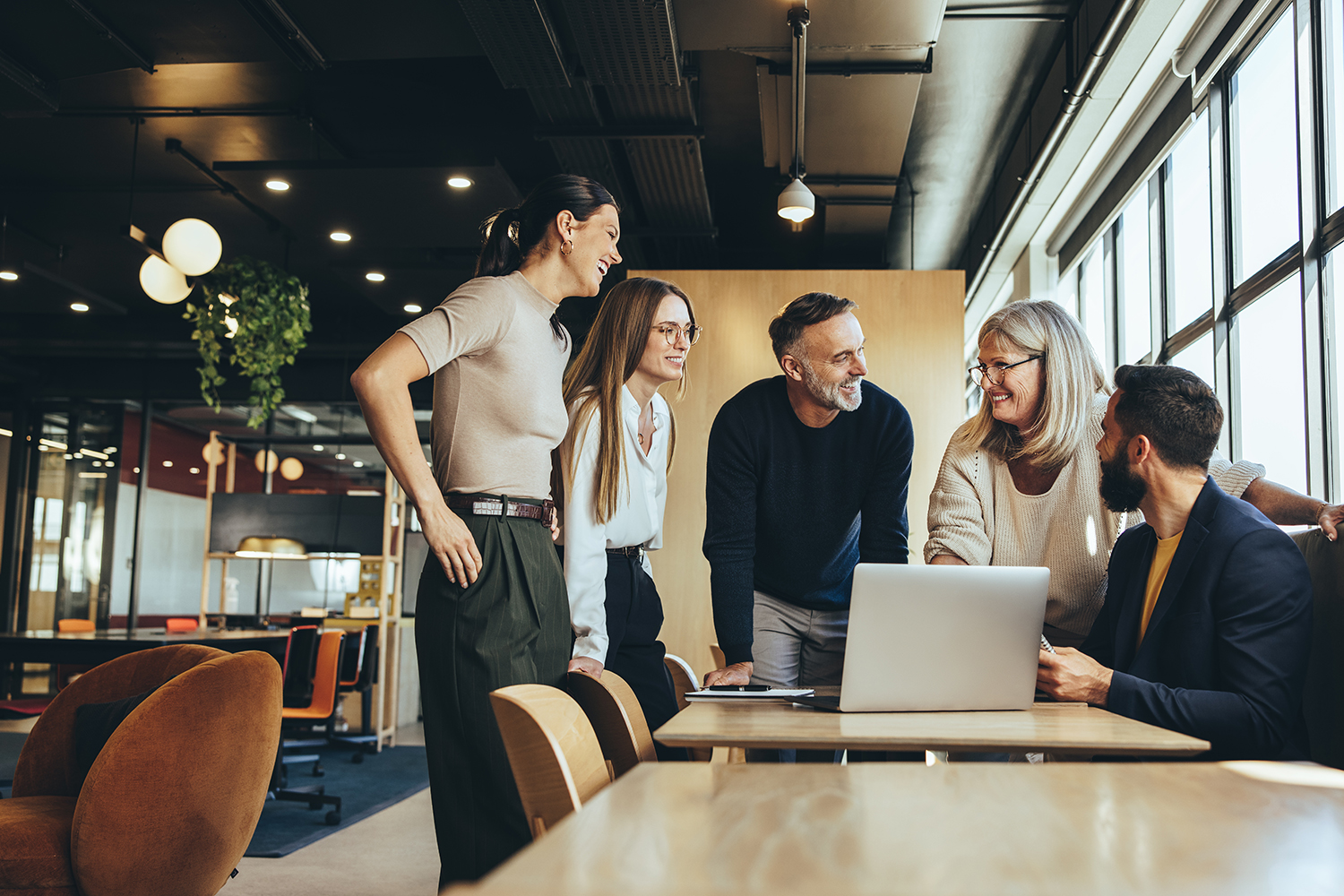a happy team discussing in an office