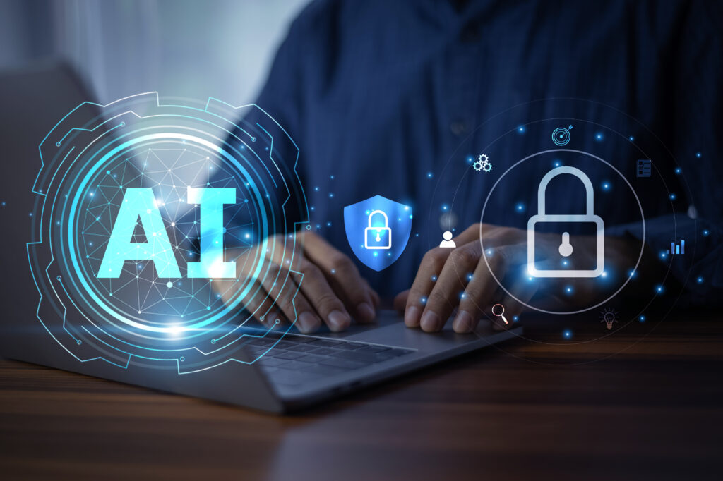 AI and lock symbols floating above a person typing on a laptop.